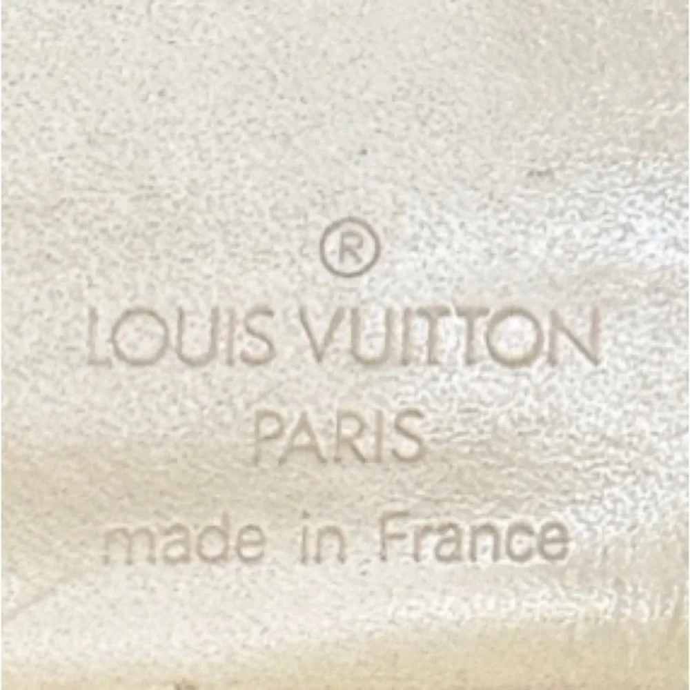 AUTHENTIC Louis Vuitton Marco Wallet. Previously owned. Light yellow.